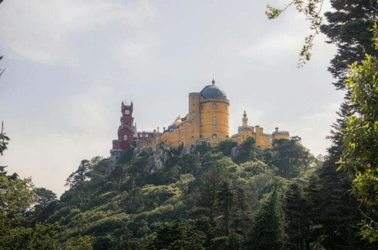 Stunning view of Pena Palace, Sintra, Lisbon, surrounded by rich greenery under 