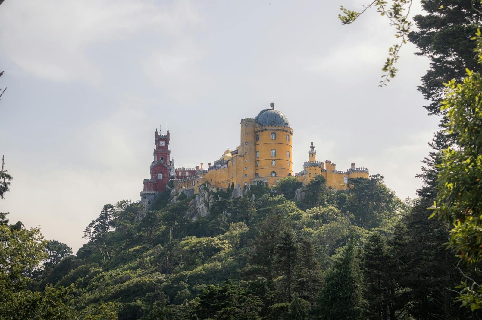Stunning view of Pena Palace, Sintra, Lisbon, surrounded by rich greenery under
