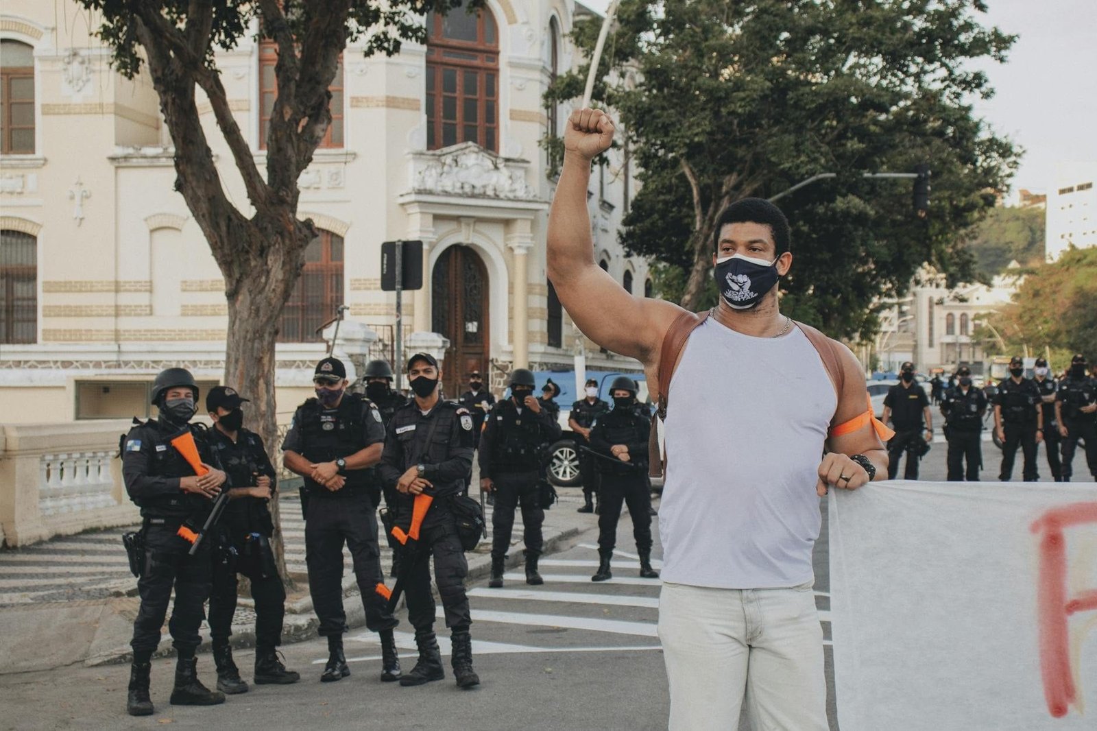 Demonstration in Rio de Janeiro with protestors and police presence, capturing activism and civil rights movement.