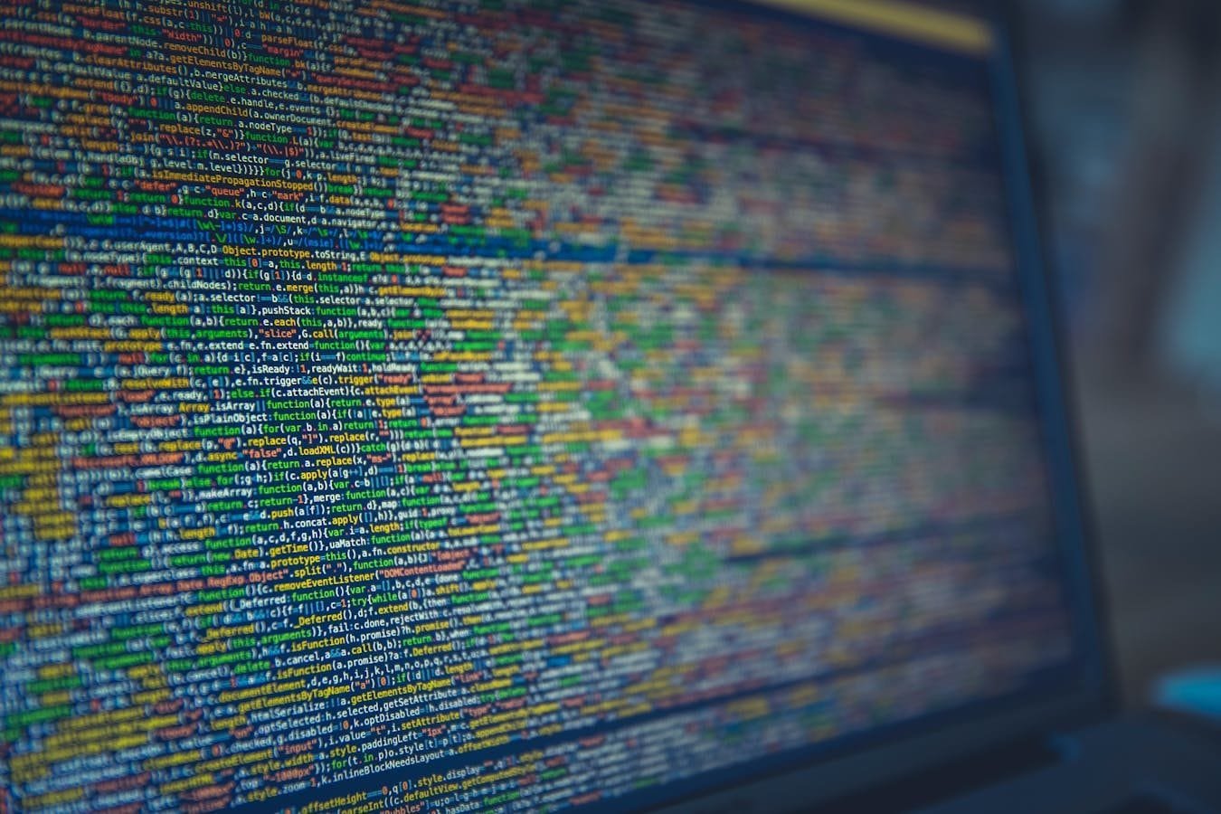 A detailed view of colorful source code displayed on a computer screen, representing modern programming and technology.