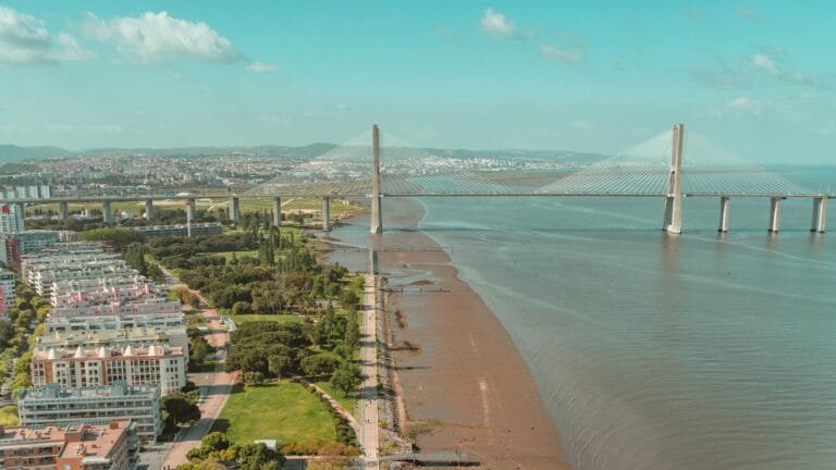 A stunning aerial shot of the Vasco da Gama Bridge and surrounding landscape in 