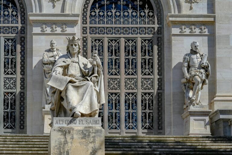 Statues of Alfonso X, Cervantes outside Biblioteca Nacional in Madrid, Spain.