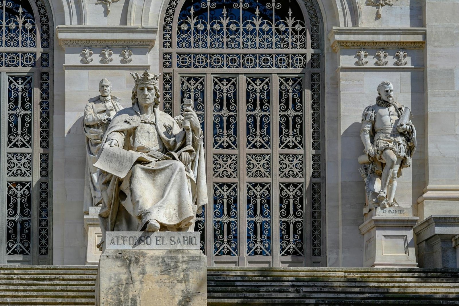 Statues of Alfonso X, Cervantes outside Biblioteca Nacional in Madrid, Spain.