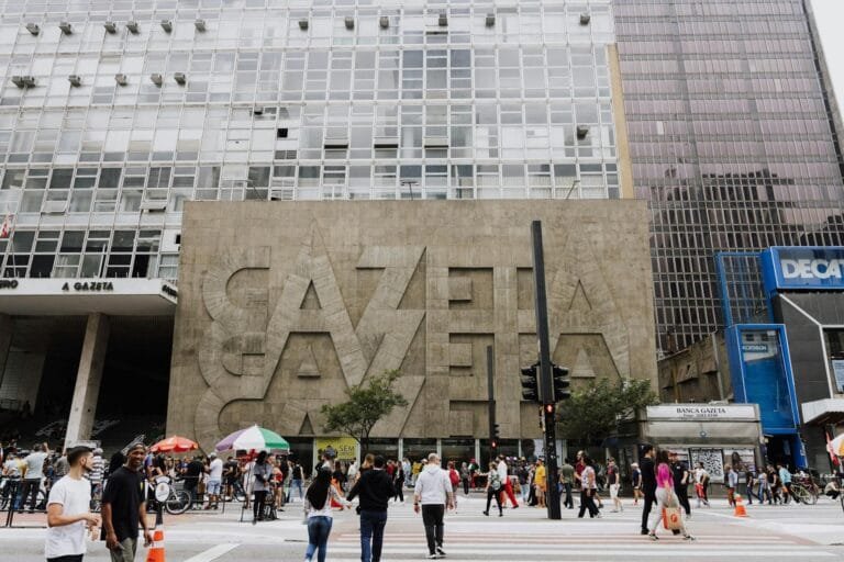 Crowded street view in front of Gazeta building on Paulista Avenue, São Paulo.
