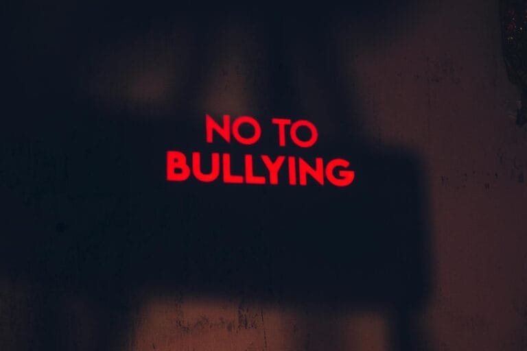 A compelling image with the message No to Bullying in bold red text on a dark 