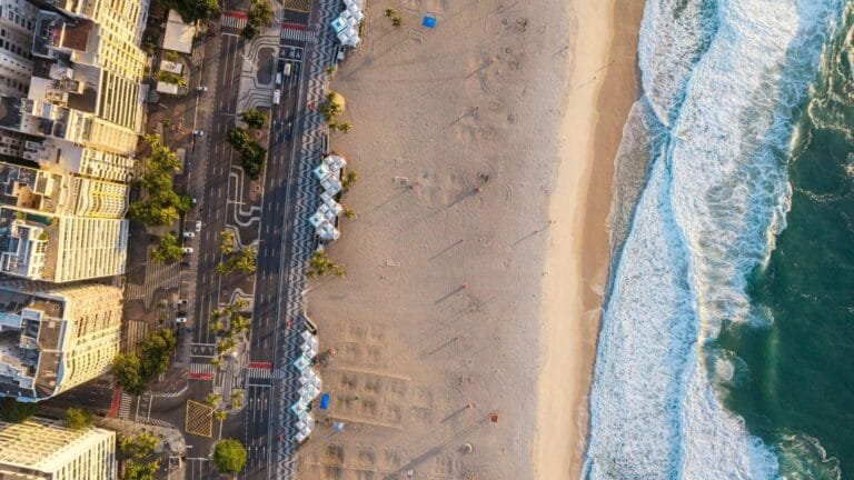 A stunning aerial shot showcasing Rio de Janeiros scenic beachfront at sunset, 
