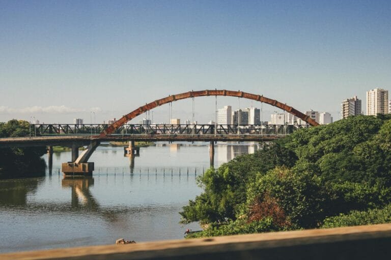 Scenic bridge view in Campos dos Goytacazes, Brazil with city skyline reflection