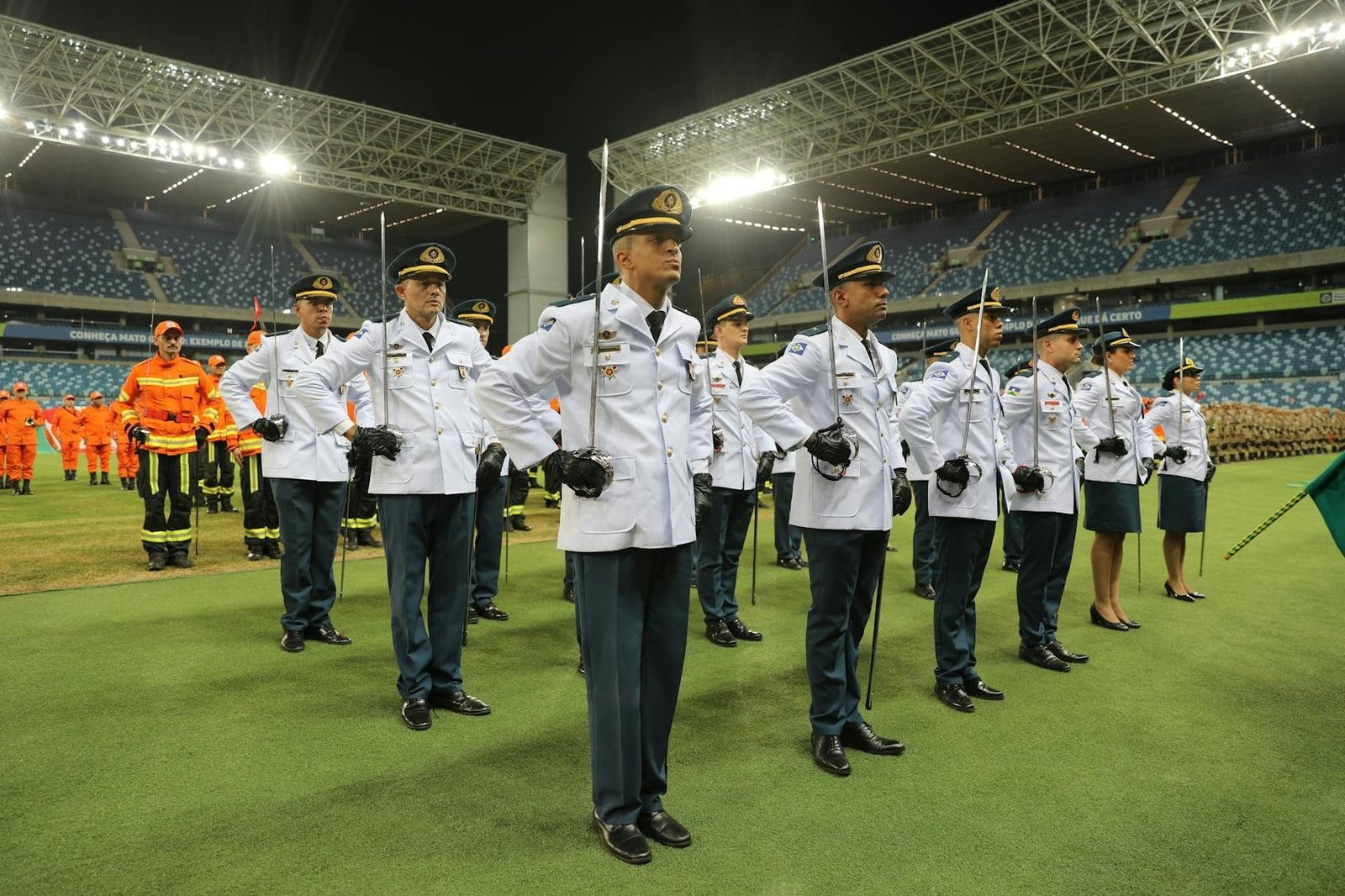 A military formation in a stadium, showcasing disciplined officers in Mato Gross