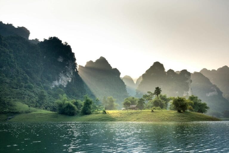 Spectacular scenery of sunlight shining through massive limestone mountains cove