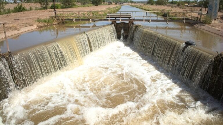 a dam with water flowing over it