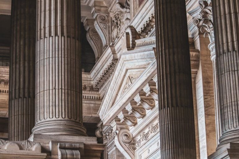 Intricate neoclassical architecture with prominent columns and ornate details.