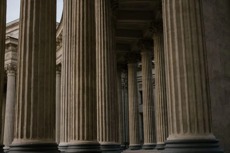Ornate stone columns in a historic building showcasing classical architecture.