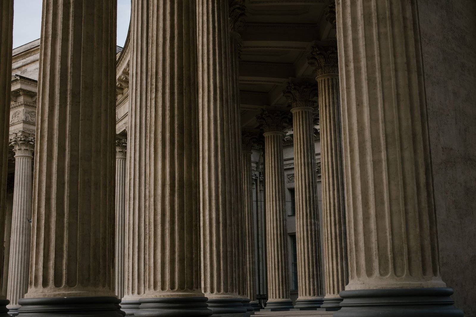 Ornate stone columns in a historic building showcasing classical architecture.