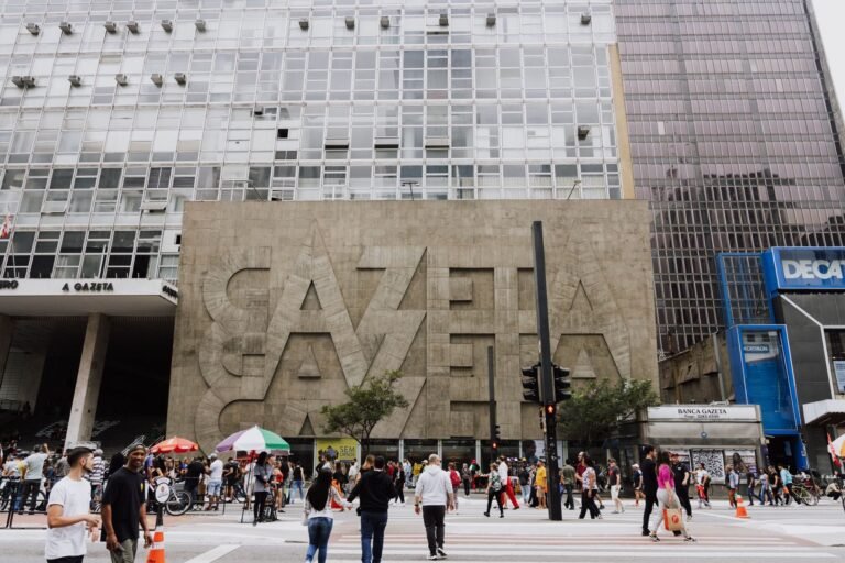 Crowded street view in front of Gazeta building on Paulista Avenue, São Paulo.