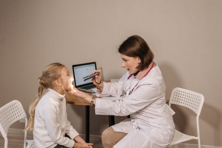 A female doctor examines a child in a clinic setting, ensuring proper medical care and attention.