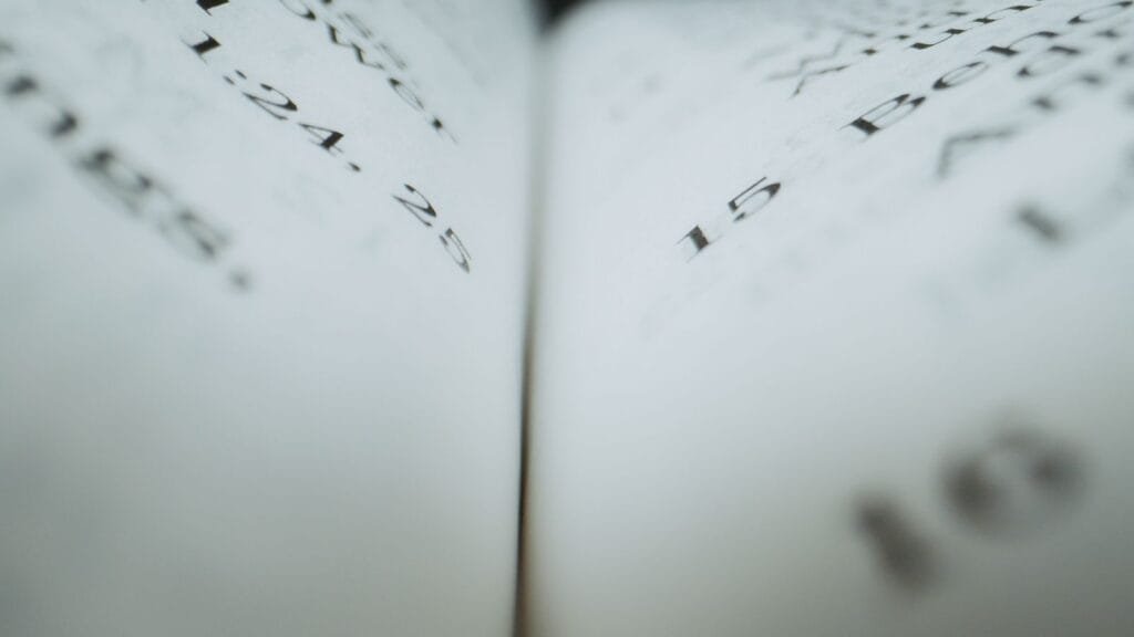 O INSS negou meu benefício. O que posso fazer agora? 1 Detailed close-up of text on book pages, ideal for reading or literary themes.