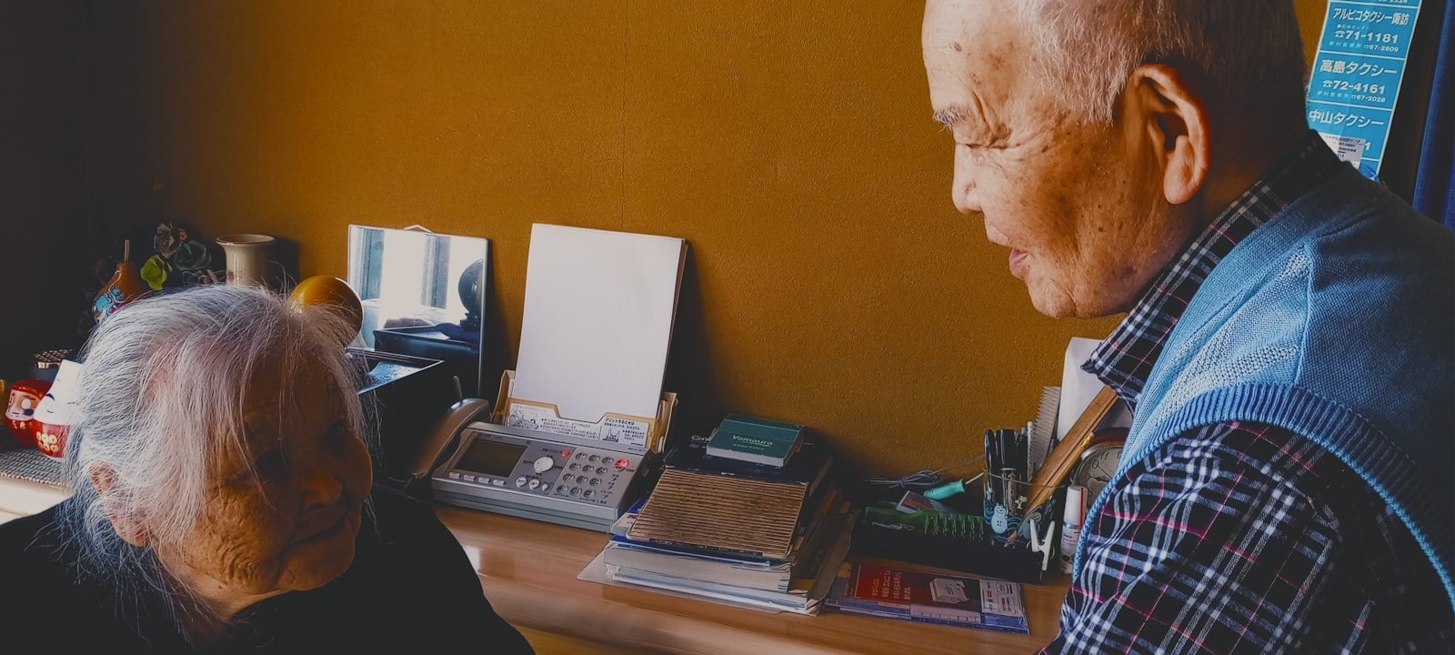 a man and a woman sitting at a desk