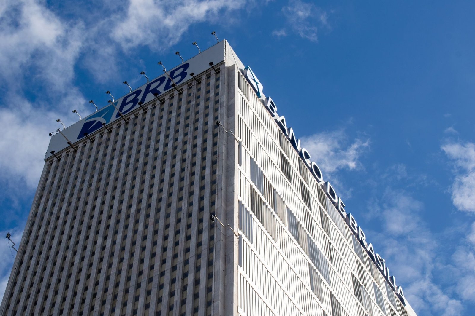 High-rise Banco de Brasília building with clear sky, capturing modern architecture against