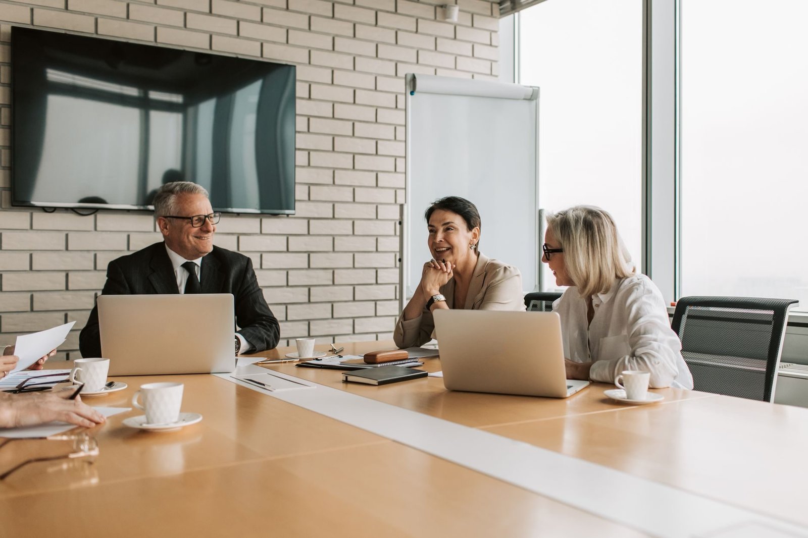 Business professionals engaging in a productive meeting in a modern office environment.