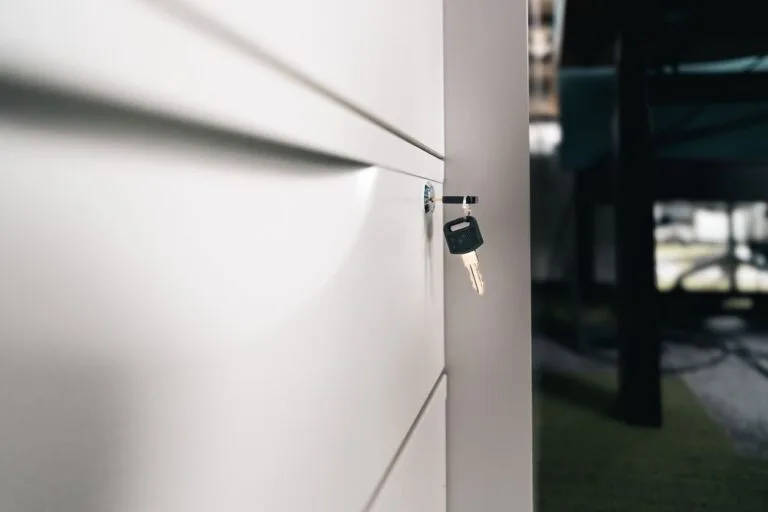 Close-up of a key in a locked office drawer for secure storage and privacy.