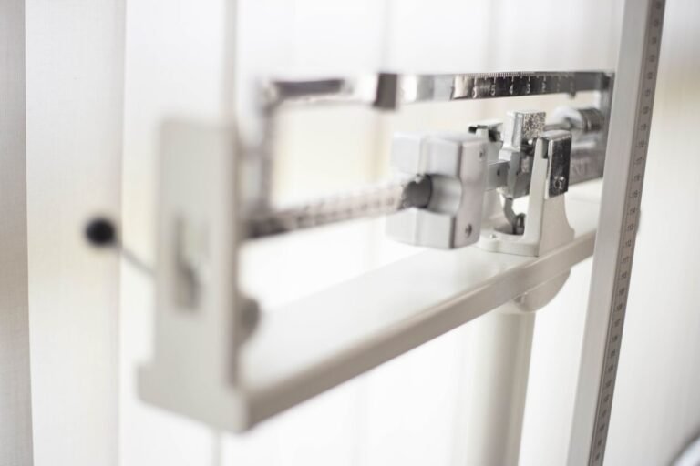 Detailed view of a classic mechanical balance scale, offering precision in weight measurement.