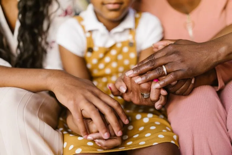 A close-up view of loving family hands holding together, symbolizing unity and support.