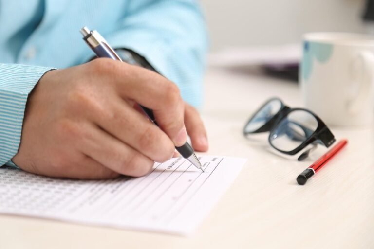 man, men, person, people, male, portrait, adult, young, fill, sheet, paper, glasses, pen, 