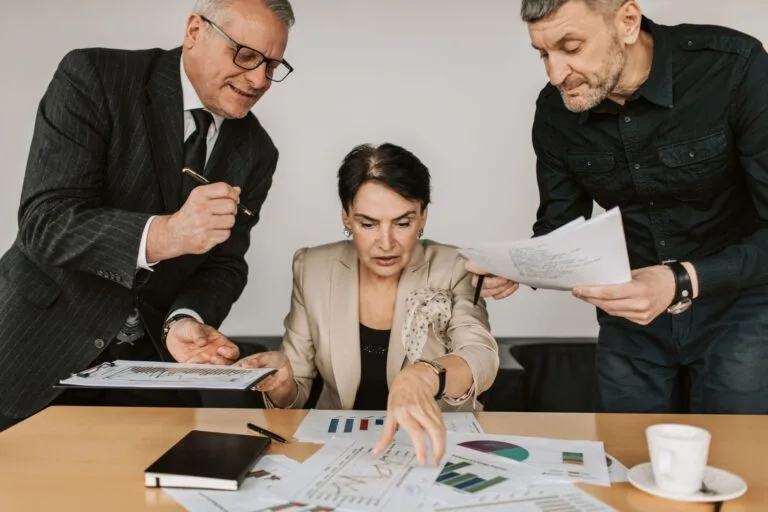 Business team collaborates on financial strategies during an office meeting. Engaged discu