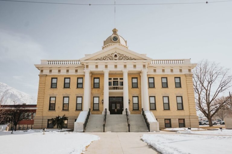 A prominent historic building in Brigham City, Utah, covered in snow during winter.