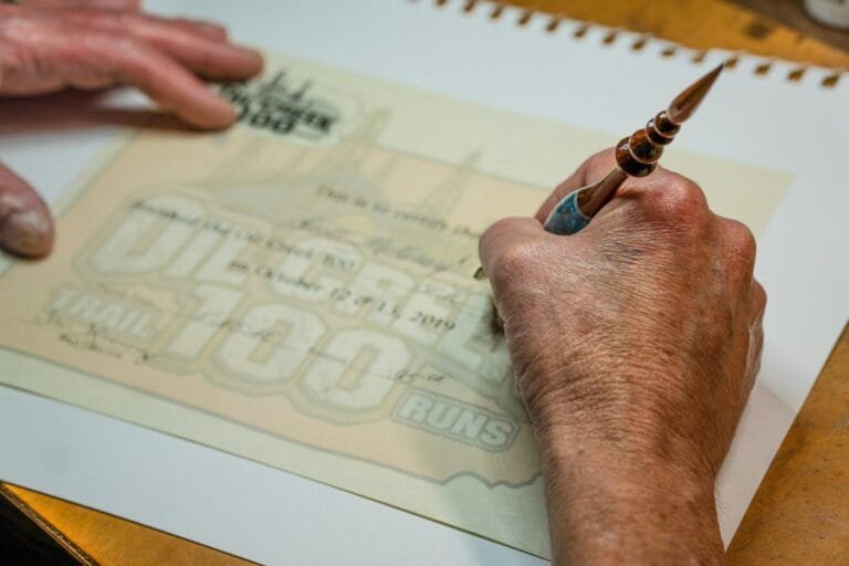a man is doing something on a piece of paper